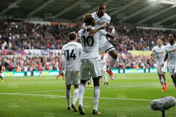 141017 - Swansea City v Huddersfield Town - Premier League - Tammy Abraham of Swansea City celebrates scoring a goal with Luciano Narsingh