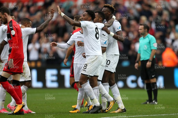 141017 - Swansea City v Huddersfield Town - Premier League - Tammy Abraham of Swansea City celebrates scoring a goal with team mates