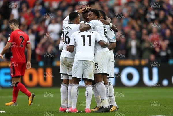 141017 - Swansea City v Huddersfield Town - Premier League - Tammy Abraham of Swansea City celebrates scoring a goal with team mates