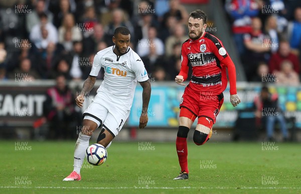 141017 - Swansea City v Huddersfield Town - Premier League - Luciano Narsingh of Swansea City is challenged by Scott Malone of Huddersfield Town
