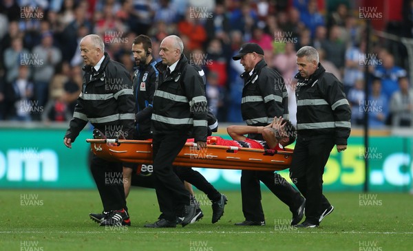 141017 - Swansea City v Huddersfield Town - Premier League - Philip Billing of Huddersfield Town leaves the field injured