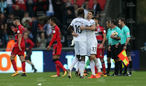 141017 - Swansea City v Huddersfield Town - Premier League - Tammy Abraham  and Federico Fernandez of Swansea City celebrate at full time