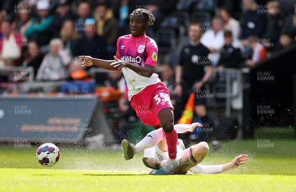 150423 - Swansea City v Huddersfield Town - SkyBet Championship - Brahima Diarra of Huddersfield is tackled by Jay Fulton of Swansea City 