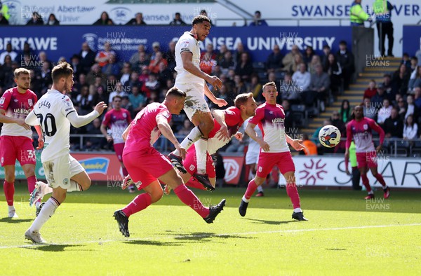 150423 - Swansea City v Huddersfield Town - SkyBet Championship - Ben Cabango of Swansea City headers the ball narrowly missing the net