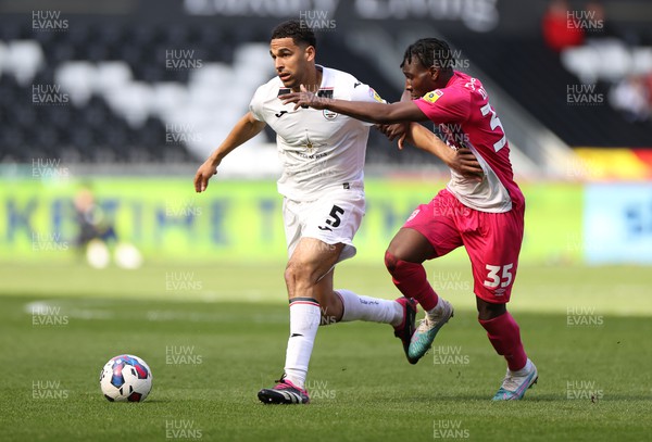 150423 - Swansea City v Huddersfield Town - SkyBet Championship - Ben Cabango of Swansea City is challenged by Brahima Diarra of Huddersfield 