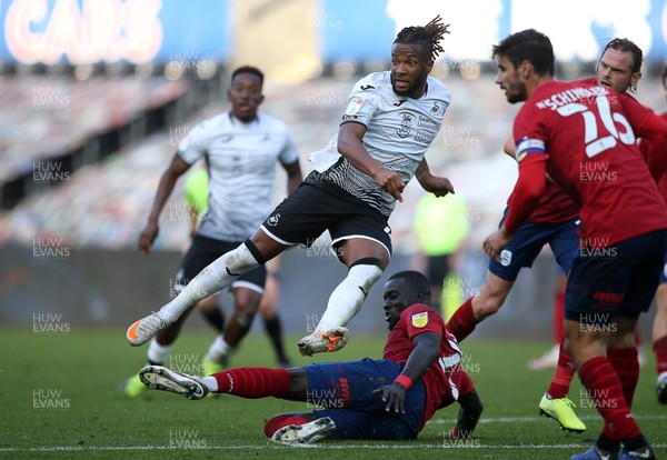 171020 - Swansea City v Huddersfield Town - SkyBet Championship - Kasey Palmer of Swansea City is tackled by Mouhamadou-Naby Sarr of Huddersfield Town
