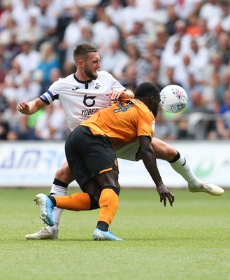 030819 - Swansea City v Hull City, Sky Bet Championship - Matt Grimes of Swansea City and Nouha Dicko of Hull City compete for the ball