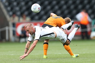 030819 - Swansea City v Hull City, Sky Bet Championship - Mike van der Hoorn of Swansea City is brought down by Daniel Batty of Hull City