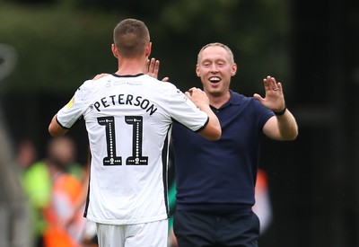 030819 - Swansea City v Hull City, Sky Bet Championship - Swansea City head coach Steve Cooper celebrates with Kristoffer Peterson of Swansea City at the end of the match