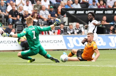 030819 - Swansea City v Hull City, Sky Bet Championship - Nathan Dyer of Swansea City sees Reece Burke of Hull City and Hull City goalkeeper George Long block his shot at goal