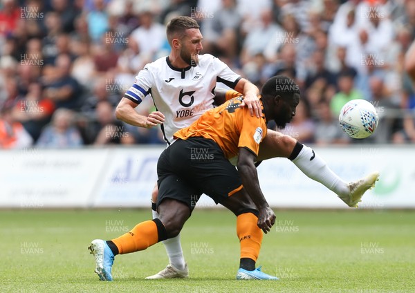 030819 - Swansea City v Hull City, Sky Bet Championship - Matt Grimes of Swansea City and Nouha Dicko of Hull City compete for the ball