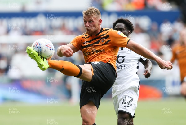 030819 - Swansea City v Hull City, Sky Bet Championship - Stephen Kingsley of Hull City clears under pressure from Nathan Dyer of Swansea City