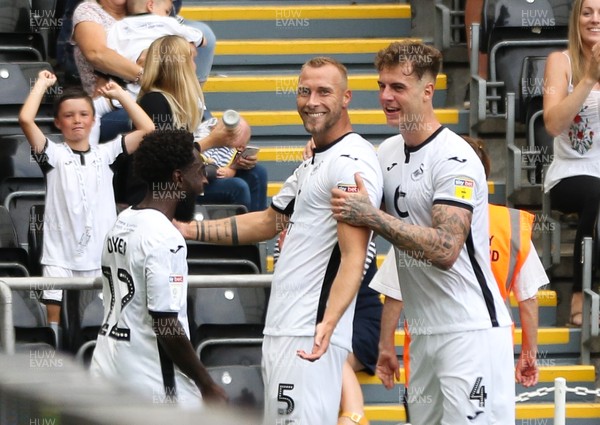 030819 - Swansea City v Hull City, Sky Bet Championship - Mike van der Hoorn of Swansea City celebrates with Nathan Dyer of Swansea City and Joe Rodon of Swansea City afters coring the second goal