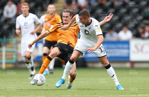 030819 - Swansea City v Hull City, Sky Bet Championship - Kristoffer Peterson of Swansea City is tackled by Jackson Irvine of Hull City
