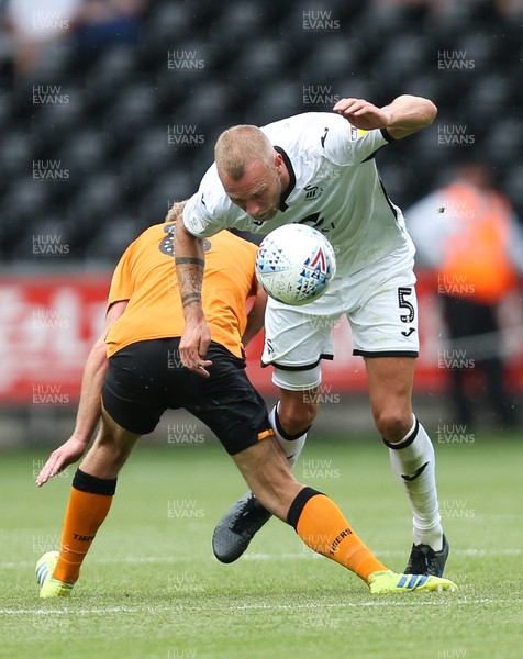 030819 - Swansea City v Hull City, Sky Bet Championship - Mike van der Hoorn of Swansea City is brought down by Daniel Batty of Hull City