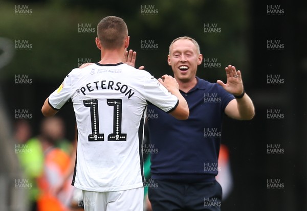 030819 - Swansea City v Hull City, Sky Bet Championship - Swansea City head coach Steve Cooper celebrates with Kristoffer Peterson of Swansea City at the end of the match