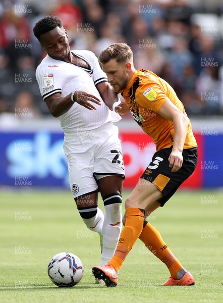 110921 - Swansea City v Hull City - SkyBet Championship - Ethan Laird of Swansea City is tackled by Callum Elder of Hull City