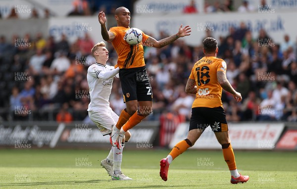 110921 - Swansea City v Hull City - SkyBet Championship - Josh Magennis of Hull City is challenged by Flynn Downes of Swansea City
