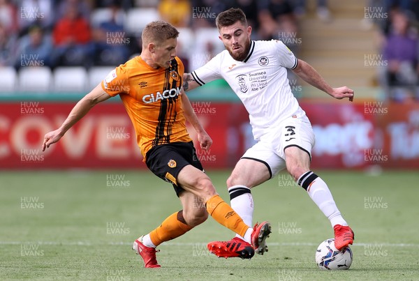 110921 - Swansea City v Hull City - SkyBet Championship - Ryan Manning of Swansea City is tackled by Greg Docherty of Hull City