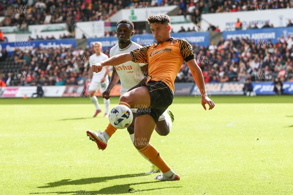 130925 - Swansea City v Hull City - Sky Bet Championship - Ryan Giles of Hull City is challenged by Zeidane Inoussa of Swansea City