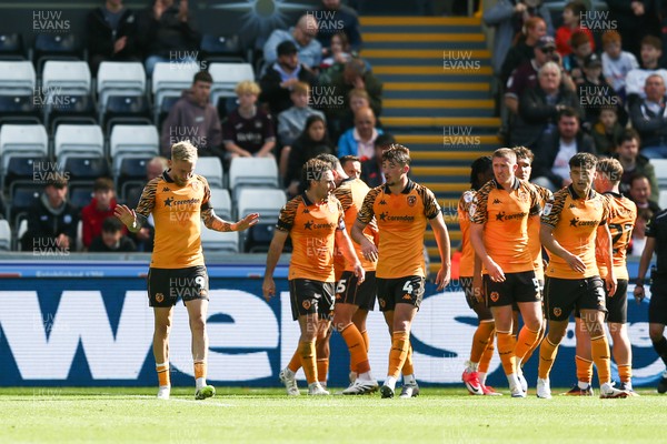 130925 - Swansea City v Hull City - Sky Bet Championship - Oli McBurnie of Hull City (L) celebrates with team mates after scoring a goal