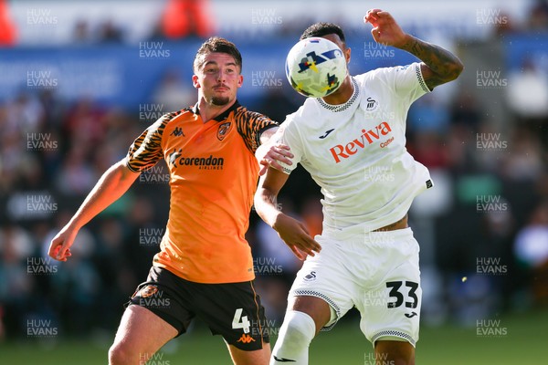 130925 - Swansea City v Hull City - Sky Bet Championship - Adam Idah of Swansea City and Charlie Hughes of Hull City compete for the ball