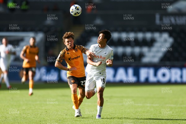 130925 - Swansea City v Hull City - Sky Bet Championship - Jisung Eom of Swansea City and Regan Slater of Hull City compete for the ball