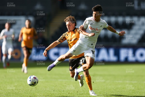 130925 - Swansea City v Hull City - Sky Bet Championship - Jisung Eom of Swansea City and Regan Slater of Hull City compete for the ball