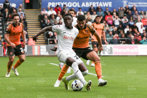130925 - Swansea City v Hull City - Sky Bet Championship - Zeidane Inoussa of Swansea City and John Egan of Hull City compete for the ball