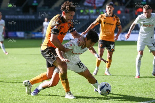 130925 - Swansea City v Hull City - Sky Bet Championship - Jisung Eom of Swansea City and Lewie Coyle of Hull City compete for the ball