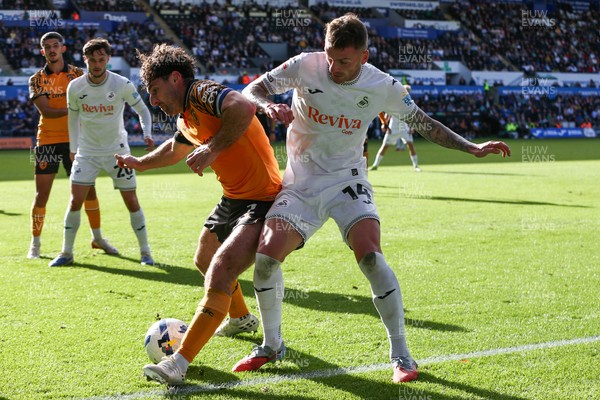 130925 - Swansea City v Hull City - Sky Bet Championship - Josh Tymon of Swansea City and Lewie Coyle of Hull City