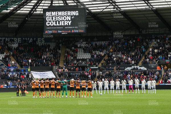 130925 - Swansea City v Hull City - Sky Bet Championship - Teams line up for a minute's silence in memory of those who died in the Gleision Colliery accident in 2011