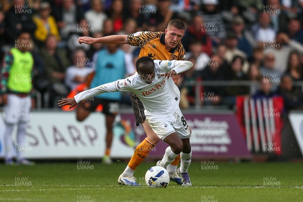 130925 - Swansea City v Hull City - Sky Bet Championship - Malick Yalcouye of Swansea City and John Lundstram of Hull City