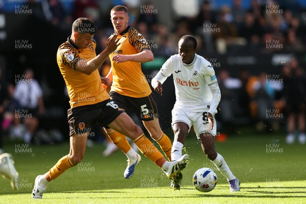 130925 - Swansea City v Hull City - Sky Bet Championship - Malick Yalcouye of Swansea City is challenged by John Egan of Hull City
