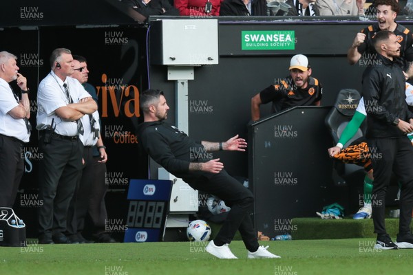 130925 - Swansea City v Hull City - Sky Bet Championship - Swansea City manager Alan Sheehan reacts by falling to the ground as Hull City score an equaliser in the 7th minute of injury time