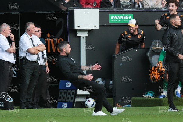 130925 - Swansea City v Hull City - Sky Bet Championship - Swansea City manager Alan Sheehan reacts by falling to the ground as Hull City score an equaliser in the 7th minute of injury time