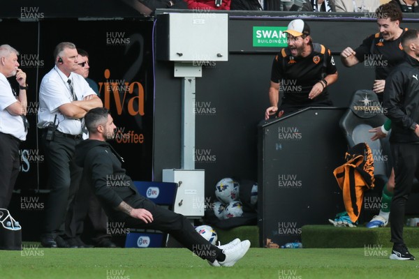 130925 - Swansea City v Hull City - Sky Bet Championship - Swansea City manager Alan Sheehan reacts by falling to the ground as Hull City score an equaliser in the 7th minute of injury time