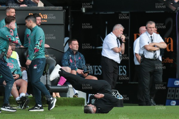 130925 - Swansea City v Hull City - Sky Bet Championship - Swansea City manager Alan Sheehan reacts by falling to the ground as Hull City score an equaliser in the 7th minute of injury time