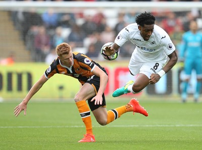 200816 - Swansea City v Hull City, Premier League - Leroy Fer of Swansea City is brought down by Sam Clucas of Hull City