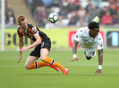 200816 - Swansea City v Hull City, Premier League - Leroy Fer of Swansea City is brought down by Sam Clucas of Hull City