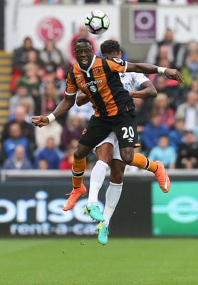 200816 - Swansea City v Hull City, Premier League - Adama Diomande of Hull City beats Kyle Naughton of Swansea City to head the ball