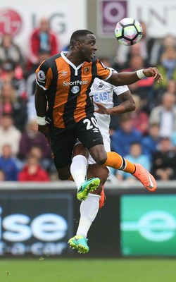 200816 - Swansea City v Hull City, Premier League - Adama Diomande of Hull City beats Kyle Naughton of Swansea City to head the ball