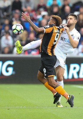 200816 - Swansea City v Hull City, Premier League - Federico Fernandez of Swansea City and Abel Hernandez of Hull City compete for the ball