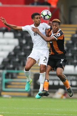 200816 - Swansea City v Hull City, Premier League - Kyle Naughton of Swansea City and Abel Hernandez of Hull City compete for the ball