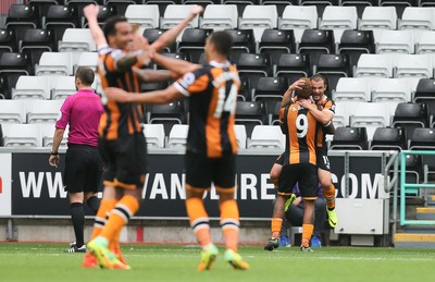 200816 - Swansea City v Hull City, Premier League - Hull City players celebrate after scoring the second goal