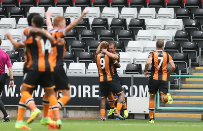 200816 - Swansea City v Hull City, Premier League - Hull City players celebrate after scoring the second goal