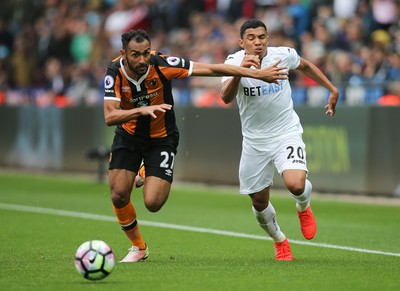 200816 - Swansea City v Hull City, Premier League -Ahmed Elmohamady of Hull City pressures Jefferson Montero of Swansea City