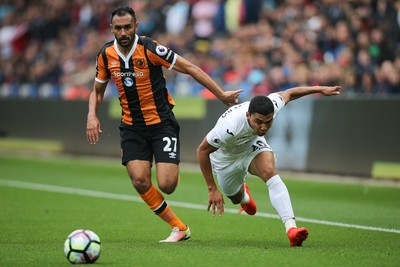 200816 - Swansea City v Hull City, Premier League -Ahmed Elmohamady of Hull City pressures Jefferson Montero of Swansea City