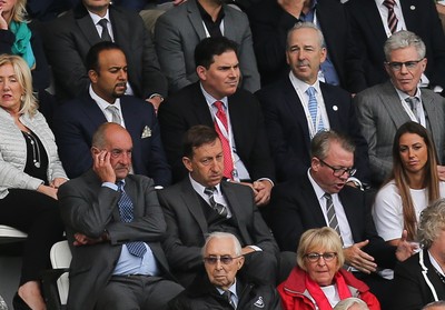 200816 - Swansea City v Hull City, Premier League - Jason Levien, , centre, red tie, one of the members of the American consortium who bough the major share in Swansea City, sat behind Chairman Huw Jenkins