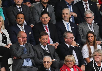 200816 - Swansea City v Hull City, Premier League - Jason Levien, centre, red tie, one of the members of the American consortium who bough the major share in Swansea City, sat behind Chairman Huw Jenkins